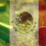 A mexican flag with the colors of red, green and yellow.