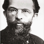 A man with long beard and glasses.